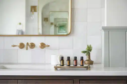 countertops 1 A white bathroom countertop and a gold mirror
