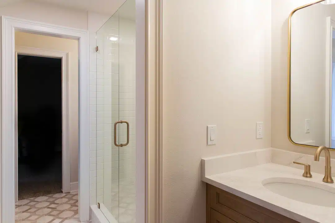 jack and jill tallahassee bathroom with quartz vanity, framed mirror, and walk-in glass shower, Brewer Upstairs